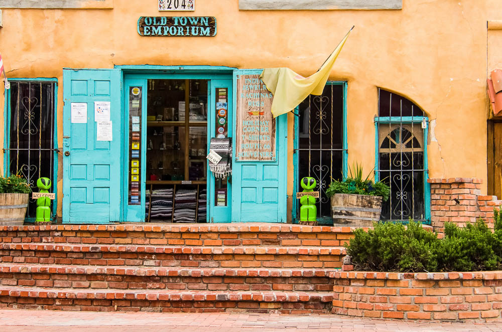 Turquoise doors and brick steps at a shop in Old Town Albuquerque