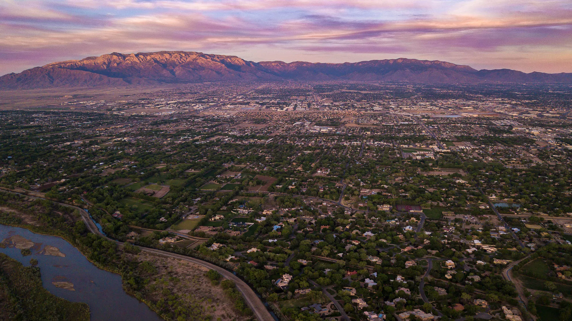 Aerial view of Albuquerque and the Sandia Mountains at sunset