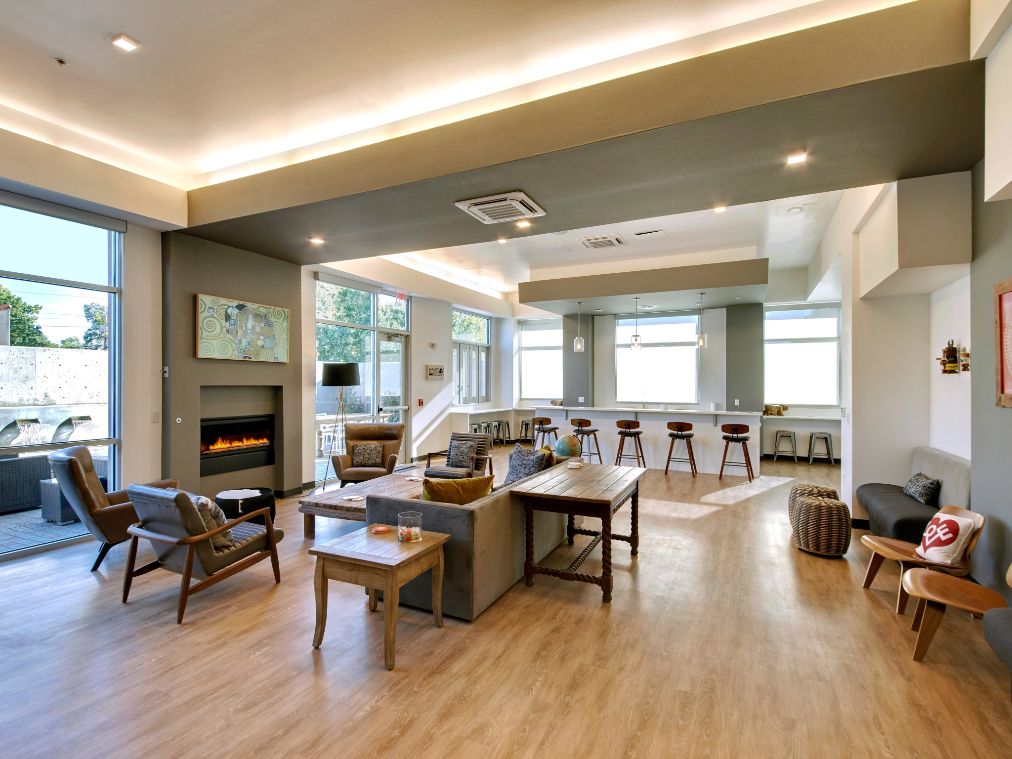 Residents' lounge with a fireplace, seating, and a coffee bar at The Franz